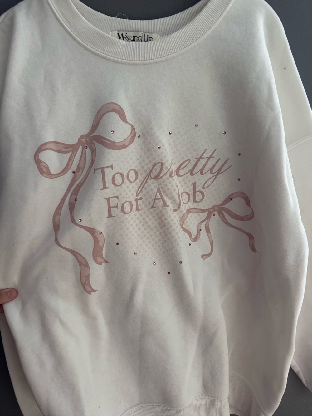 Wound Up Cream Sweatshirt with Pink Bow Graphic